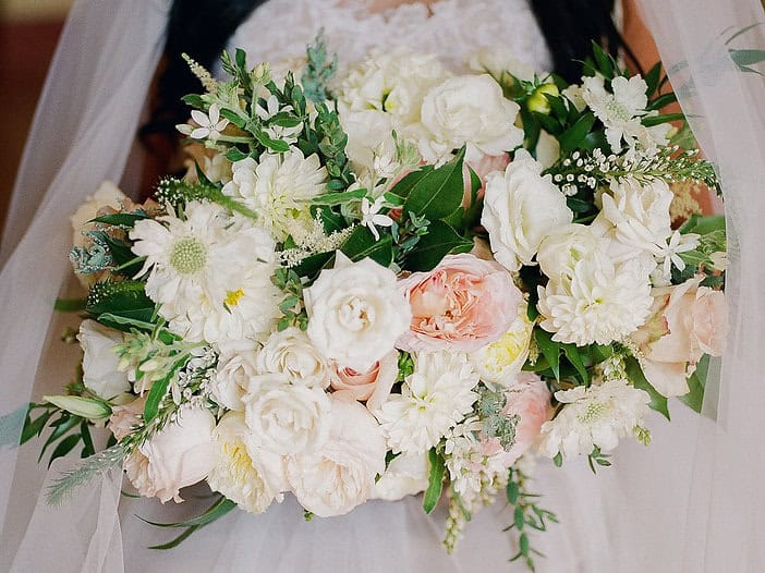Beautiful white and blush floral arrangement for wedding decor or bridal bouquet.