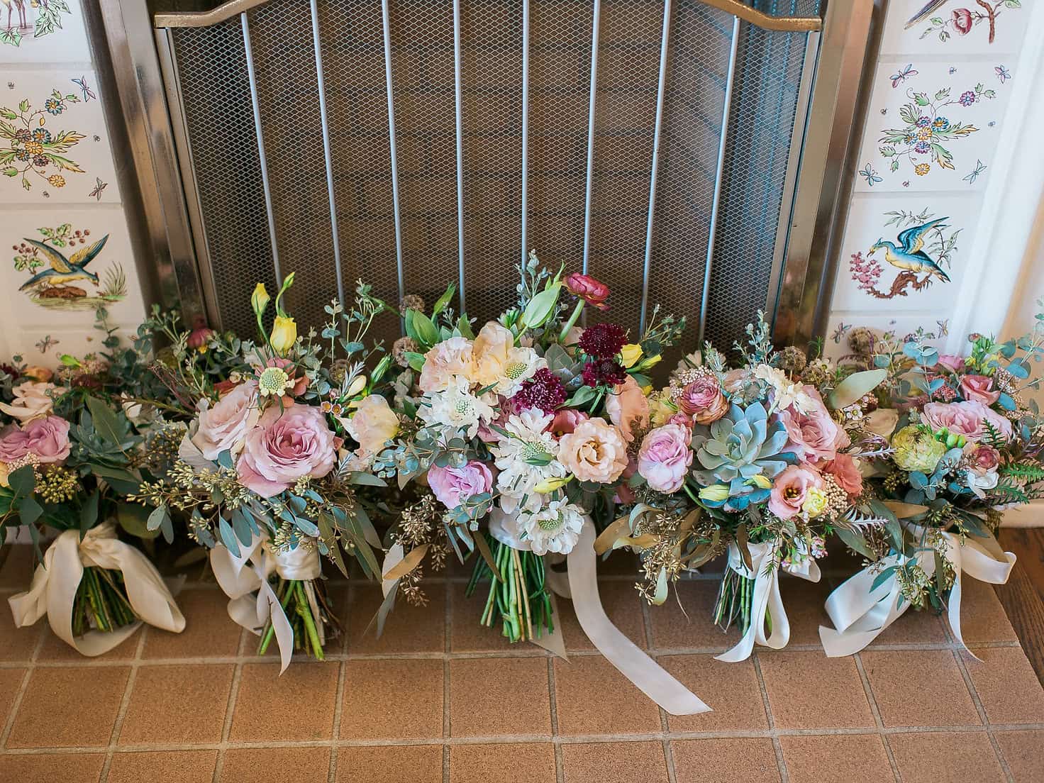 Elegant floral arrangements for a sophisticated event with roses, hydrangeas, and greenery at Type A.