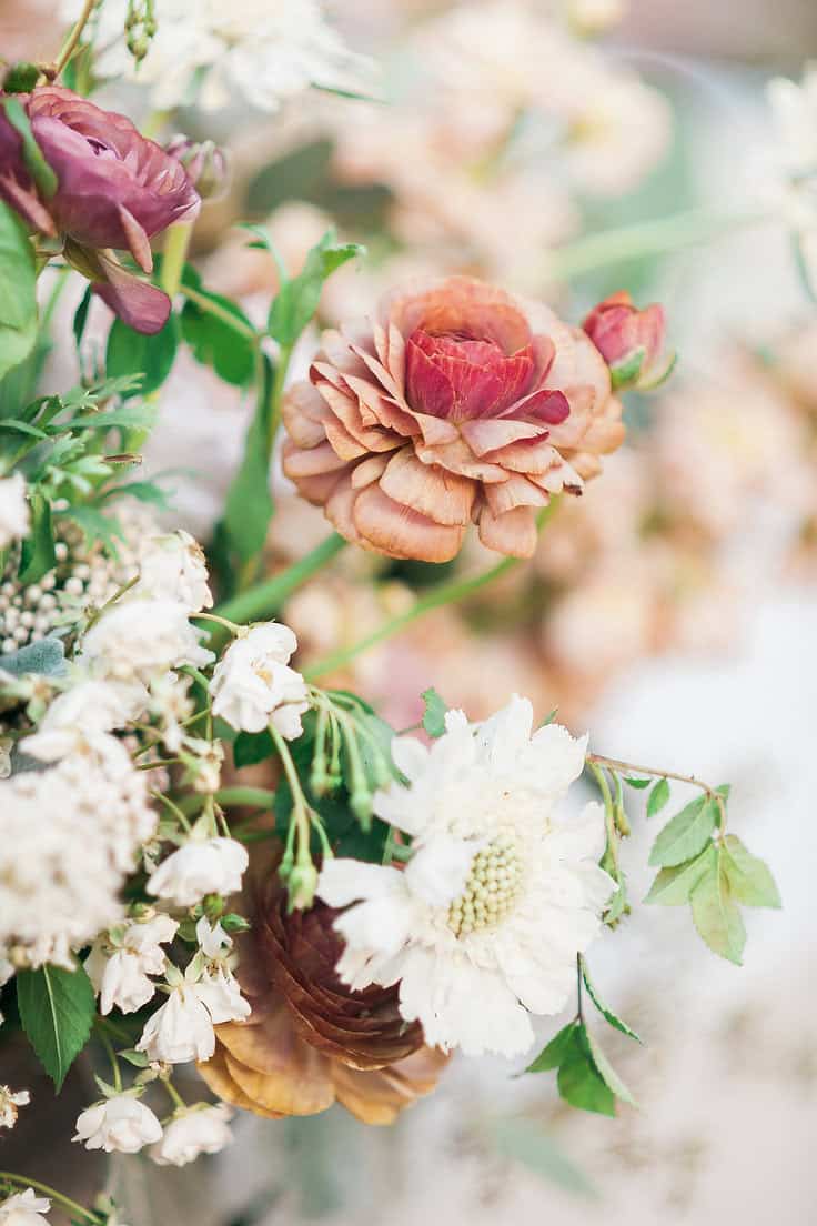 Elegant floral arrangement with roses and peonies for a stylish soirée.