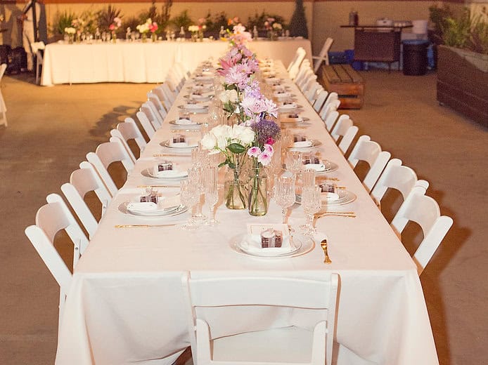 Elegant banquet table setup with floral centerpieces for a sophisticated event.