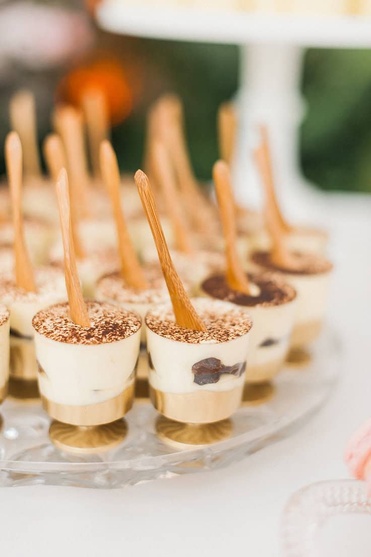 Dessert cups with chocolate and vanilla mousse, garnished with chocolate sticks for a sophisticated.